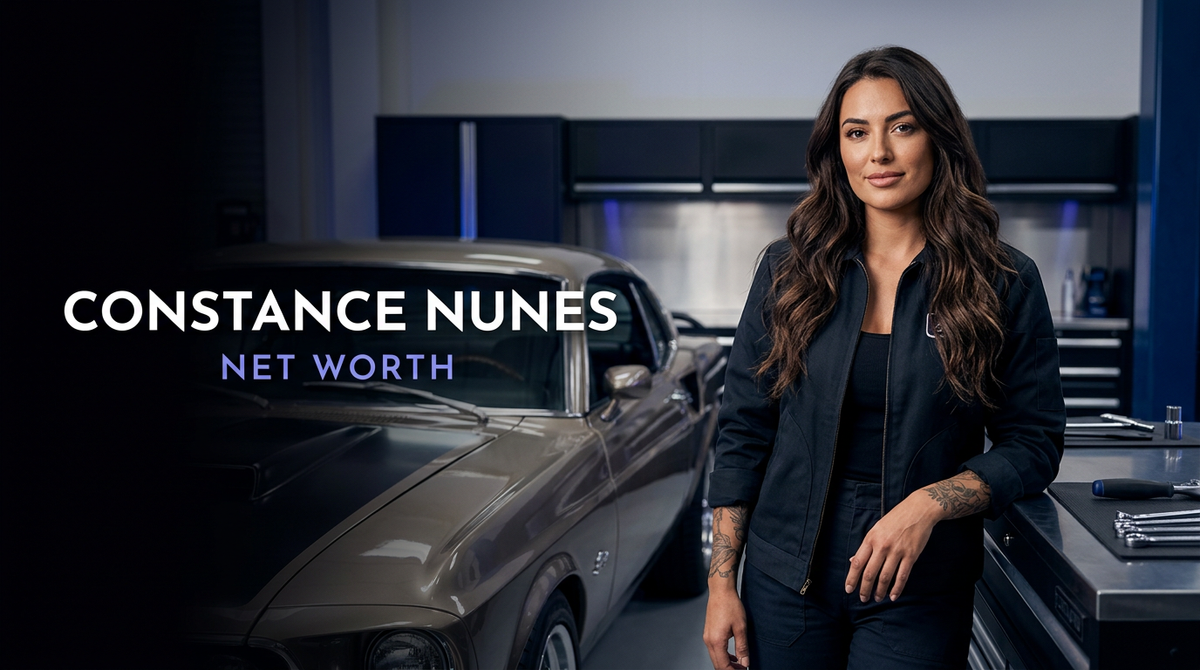 Constance Nunes standing in an automotive fabrication garage beside a classic engine build