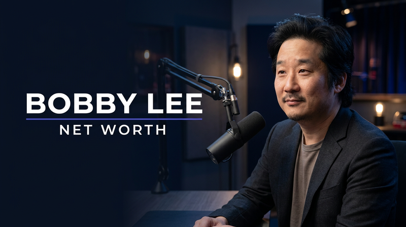 Comedian and podcast host Bobby Lee speaking into a studio microphone during a live recording